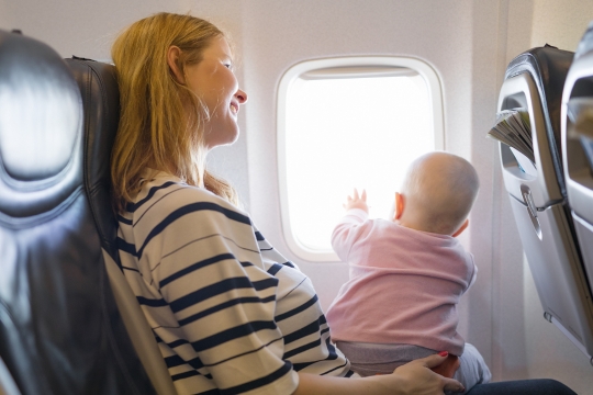 Women in a plane with baby
