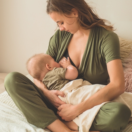 Portrait of mom and breastfeeding baby